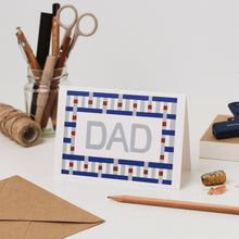 Load image into Gallery viewer, Greeting card with 'DAD' on a desk with stationery items