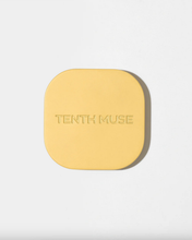 Load image into Gallery viewer, Yellow square compact with 'Tenth Muse' branding on a light gray background