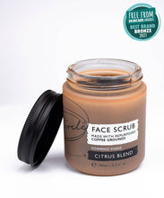 Load image into Gallery viewer, Jar of face scrub with a black lid on a white background, featuring an award badge at the top.