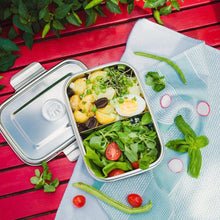 Load image into Gallery viewer, Metal lunch box with salad on a red wooden table