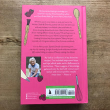 Load image into Gallery viewer, Back cover of a pink book with illustrations and text on a wooden surface