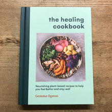 Load image into Gallery viewer, Book titled 'The Healing Cookbook' on a wooden surface