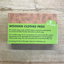 Load image into Gallery viewer, Box of wooden clothes pegs with green label on a wooden surface