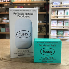 Load image into Gallery viewer, Fussy deodorant packaging on a wooden surface with a blurred store background