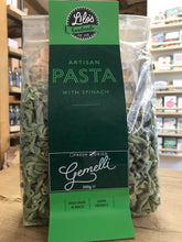 Load image into Gallery viewer, Packaged green pasta with spinach on a wooden surface