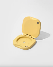 Load image into Gallery viewer, Yellow metal compact on a white background