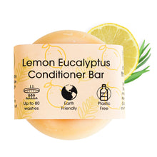 Load image into Gallery viewer, Lemon Eucalyptus Conditioner Bar with packaging, lemon slice, and leaves on a white background