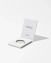 Load image into Gallery viewer, Product packaging with a small round item and a card on a white background
