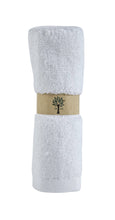 Load image into Gallery viewer, White towel with a brown label featuring a tree design on a white background
