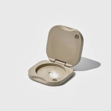Load image into Gallery viewer, Beige metal compact on a white background
