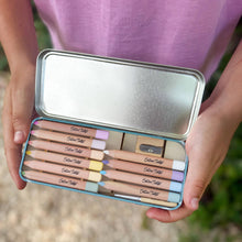 Load image into Gallery viewer, Metallic pencil case with colored pencils held by a person wearing a purple shirt.
