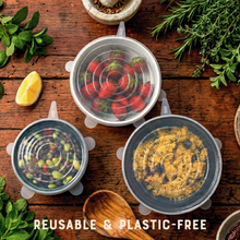 Load image into Gallery viewer, Reusable silicone food covers on a wooden surface with fresh ingredients
