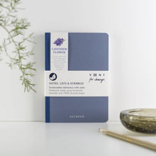 Load image into Gallery viewer, Blue notebook with lavender design on a white surface with a plant and candle in the background
