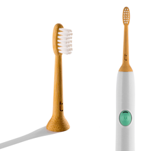 Load image into Gallery viewer, Bamboo toothbrush and white electric toothbrush with green power button on a white background
