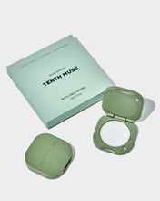 Load image into Gallery viewer, Green refillable perfume vessel and packaging with 'Tenth Muse' branding on a light gray background.
