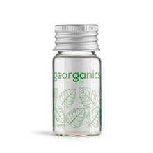 Load image into Gallery viewer, Clear bottle with green leaf patterns and 'georganics' branding on a white background
