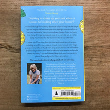 Load image into Gallery viewer, Back cover of a book with text and a photo on a wooden surface
