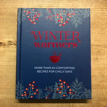Load image into Gallery viewer, Book titled &#39;Winter Warmers&#39; with decorative elements on a wooden surface
