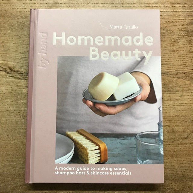 Book titled 'Homemade Beauty' on a wooden surface