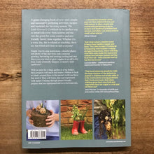 Load image into Gallery viewer, Back cover of a book with text and images on a wooden surface
