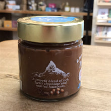 Load image into Gallery viewer, Jar of chocolate spread with a gold lid on a wooden surface
