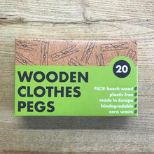 Load image into Gallery viewer, Box of wooden clothes pegs with green label on a wooden surface
