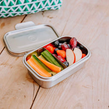 Load image into Gallery viewer, Metal lunch box with fruits and vegetables on a wooden surface
