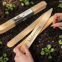 Load image into Gallery viewer, Wooden garden labels being used in soil with a hand holding one labeled 'Watercress'.
