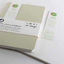Load image into Gallery viewer, Notebook with green and white design on a light gray background
