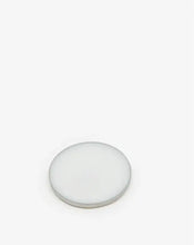Load image into Gallery viewer, A off-white circular solid perfume pan, photographed on a seamless white background.
