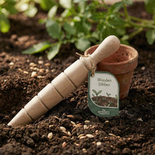 Load image into Gallery viewer, Wooden dibber with a tag on soil next to a small potted plant
