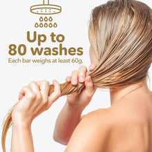 Load image into Gallery viewer, Person holding wet hair with text about shampoo bar durability and weight.
