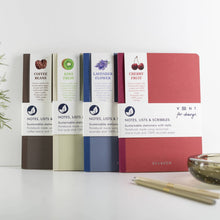 Load image into Gallery viewer, Four notebooks with different colored covers and labels on a white surface.
